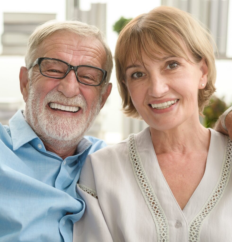 Same Day Tooth Replacement Options Smiling senior couple after same-day tooth replacement in Waltham